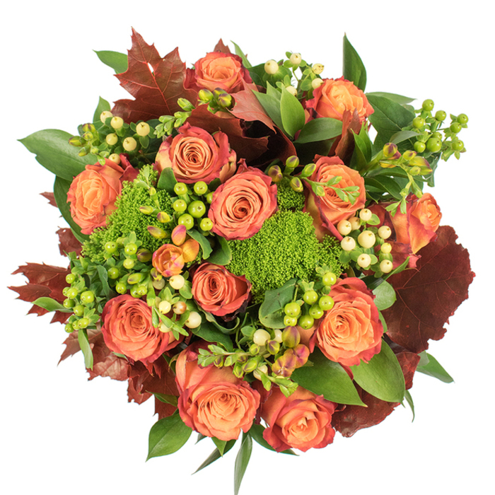 Captured from above on a crisp white field, this dense, circular bouquet offers a studied celebration of autumnal colour and texture that would sit beautifully on an Elmers End dining table. The dominant element is a collection of large, fully unfurled roses, their petals graduating from a soft, warm orange at the heart to coral and finally to russet-tinted edges, each bloom appearing like a miniature, hand-painted leaf. Between these roses are bright clusters of Hypericum berries in lime green and creamy yellow, their glossy spheres providing delicate punctuation against the velvety petals.
Adding a sculptural, tactile quality are rounded tufts of green trick dianthus, their plush, moss-like appearance and vivid chartreuse hue bringing an unexpected, almost woodland softness to the arrangement. Interwoven are deep, lobed leaves in shades of burgundy and burnt orange, which echo autumn leaves and give the bouquet a grounded, seasonally authentic silhouette. Layered fresh greens-broad and shiny alongside finer serrated foliage-create a full, lush backdrop that reinforces the feeling of abundance.
Soft, natural light accentuates the velvety textures and nuanced colour transitions, while subtle shadowing gives the composition depth. A faint floral perfume mingles with an earthy green note, suggesting a room warmed by late-afternoon sun. Elegant and hearty at once, this arrangement is ideal for Thanksgiving centrepieces, cosy home decor, or as a seasonal gift to celebrate harvest and gratitude across local streets from Elmers End Green to the nearby lanes.